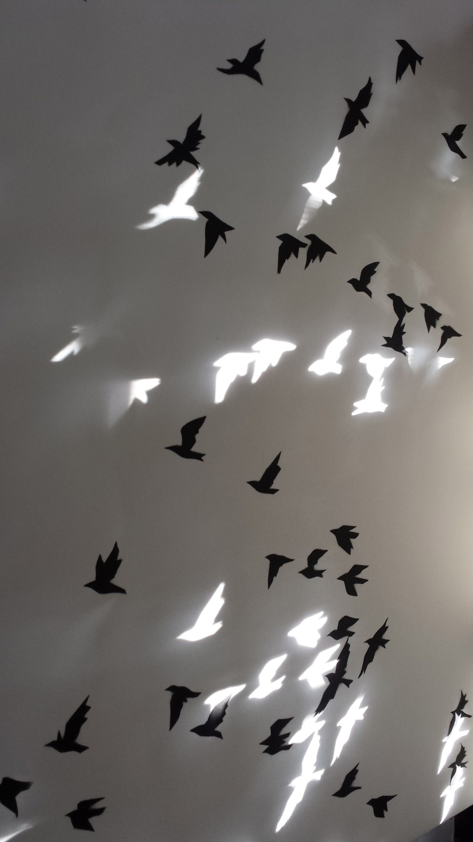 (Mico A. Fuentes, “Negative and Positive Birds,” 24 x 36, liberated paper and spray paint.)